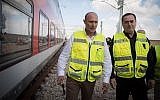 Israel Railways CEO Shahar Ayalon, center, with Israeli Minister of Transportation Israel Katz, right, during a test drive of the Jerusalem-Tel Aviv express train in central Israel, January 16, 2018. (Hadas Parush/Flash90)