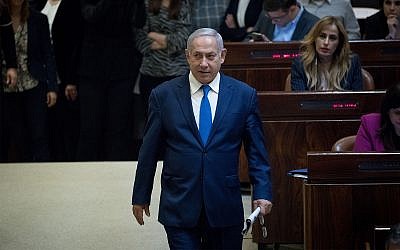 Prime Minister Benjamin Netanyahu arrives to a Plenary Hall session for the vote on a bill to dissolve parliament, at the Knesset, in Jerusalem on December 26, 2018. (Yonatan Sindel/Flash90)