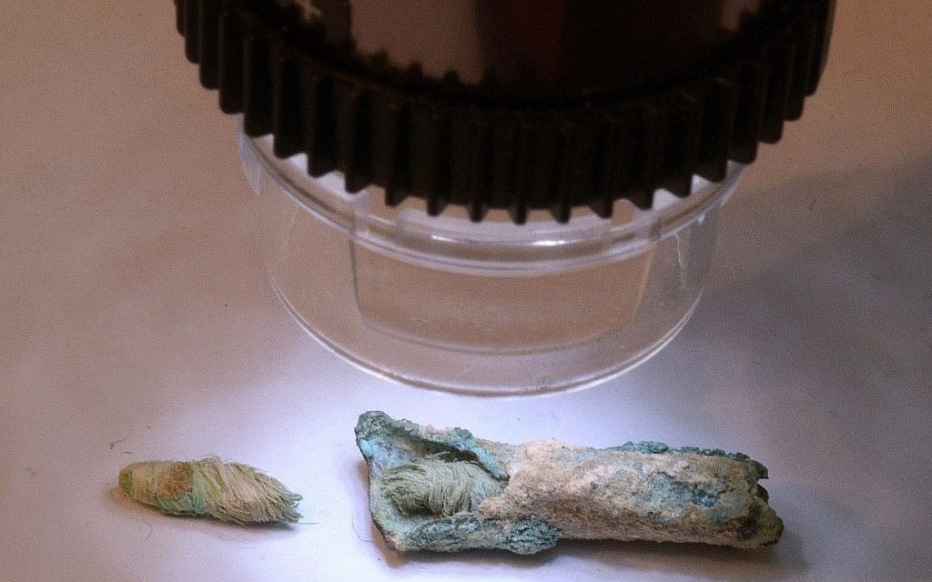 Examination of the Byzantine-period flax wick that was used to light lamps some 1,500 years ago, discovered in the 1930s American Colt expedition to the Negev site of Shivta. (Clara Amit, Israel Antiquities Authority)