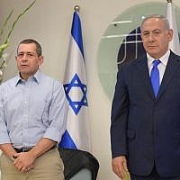 Then-Shin Bet chief Nadav Argaman, left, and Prime Minister Benjamin Netanyahu attend an awards ceremony at the Shin Bet's headquarters in Tel Aviv honoring agents who excelled in intelligence operations in 2017 and 2018, on December 4, 2018. (Amos Ben Gershom/GPO)