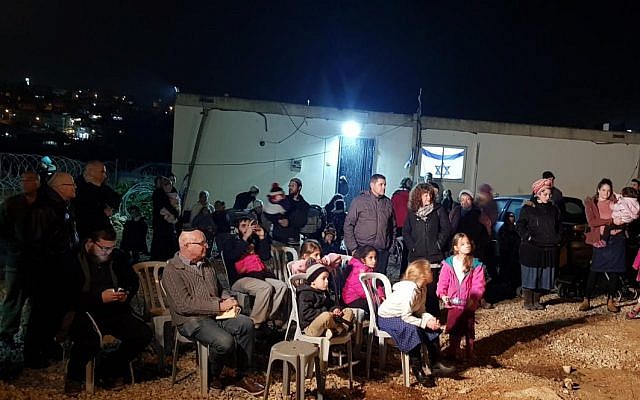 Settlers from Kiryat Arba attend a ceremony at the Mevaser outpost marking the first families to move into the hilltop community in response to recent spate of Palestinian attacks on December 16, 2018. (Kiryat Arba Hebron Local Council) Settlers from Kiryat Arba attend a ceremony at the Mevaser outpost marking the first families to move into the hilltop community in response to recent spate of Palestinian attacks on December 16, 2018. (Kiryat Arba Hebron Local Council)