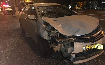 A damaged car is seen after it struck an Israeli combat soldier on Route 232 in southern Israel on December 19, 2018. (Israel Police)