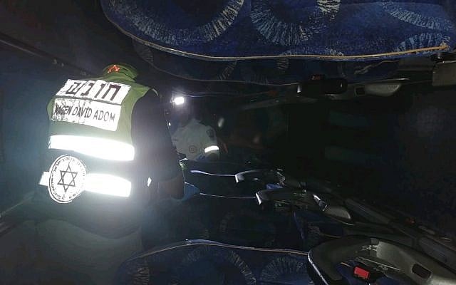 Paramedics in an overturned bus in the Galilee, December 22, 2018 (Magen David Adom) Paramedics in an overturned bus in the Galilee, December 22, 2018 (Magen David Adom)