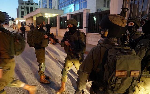 In this undated photograph, Israeli troops search for the terrorists who committed a shooting attack on a bus stop outside the Ofra settlement in the West Bank, near Ramallah, in which seven Israelis were injured, including a pregnant woman, on December 9, 2018. (Israel Defense Forces) In this undated photograph, Israeli troops search for the terrorists who committed a shooting attack on a bus stop outside the Ofra settlement in the West Bank, near Ramallah, in which seven Israelis were injured, including a pregnant woman, on December 9, 2018. (Israel Defense Forces)