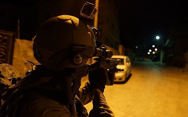 In this undated photograph, Israeli troops search for the terrorist who committed a brutal shooting attack in the Barkan industrial park in the northern West Bank in which two Israelis were killed on October 7, 2018. (Israel Defense Forces) In this undated photograph, Israeli troops search for the terrorist who committed a brutal shooting attack in the Barkan industrial park in the northern West Bank in which two Israelis were killed on October 7, 2018. (Israel Defense Forces)