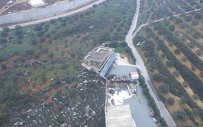A photo released by the IDF on December 27, 2018, shows fluids the army says it used to seal cross-border attack tunnels dug by Hezbollah coming out of a civilian building in the southern Lebanese village of Kafr Kila. (IDF Spokesperson)