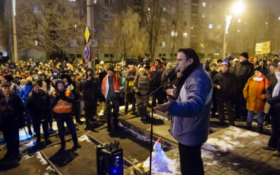 MP Adam Mirkoczky, chairman of the oppositional party Jobbik's Heves county office, delivers his speech during the rally held against the government in Eger, Hungary, Wednesday, Dec. 19, 2018. (Peter Komka/MTI via AP)