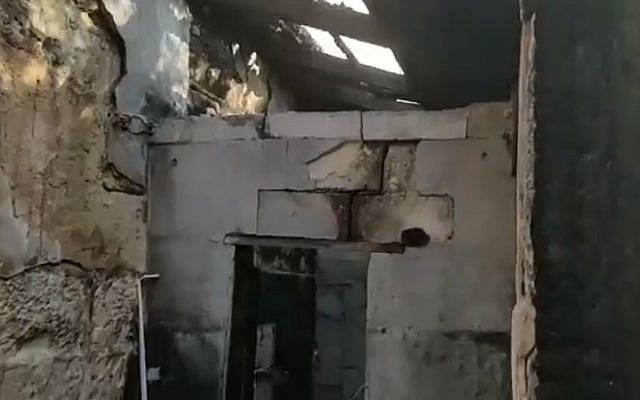 The burned-out remains of a small dwelling near the Church of Mary Magdalene on the slopes of the Mount of Olives, engulfed in a fire on December 23, 2018, that claimed the life of 91-year-old nun Silva Maria Selaso. (Kan screen capture)