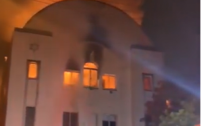 A fire burns in Beit Midrash Morasha, also known as Arthur’s Road Shul in Cape Town, South Africa on December 4, 2018 (Screenshot/YouTube)