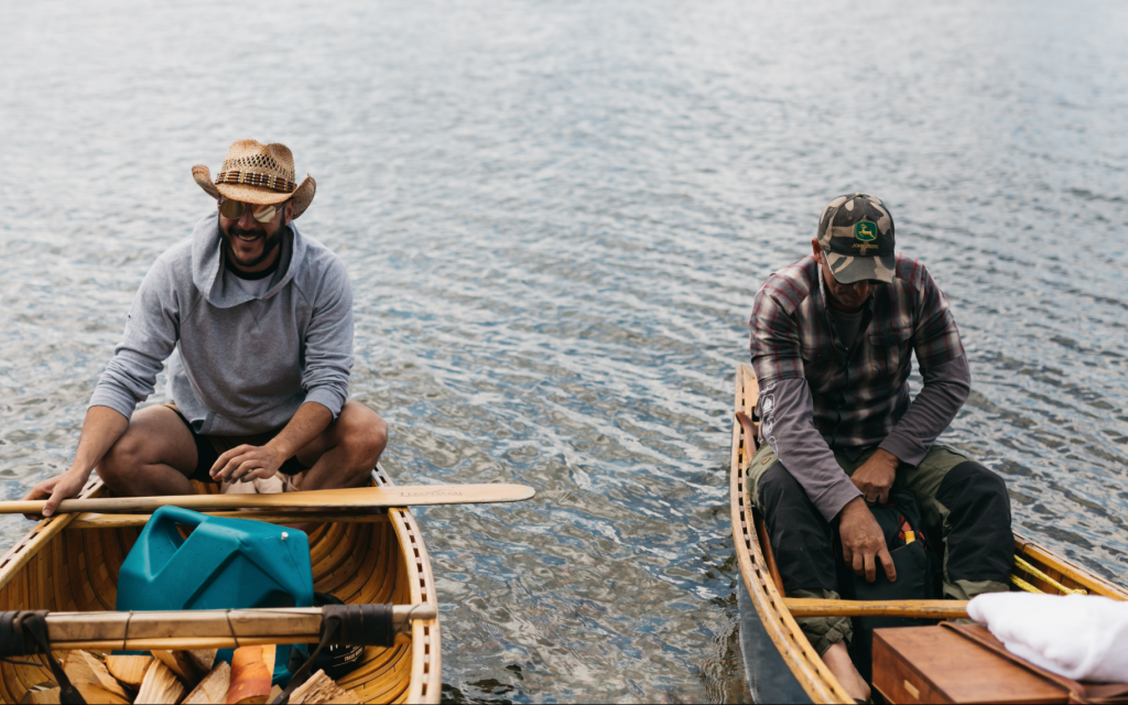 Anthony Rose, left, goes canoeing on Obabika Lake, about 300 miles north of his hometown of Toronto, as part of a group camping trip. (Courtesy Kayla Rocca Photography)