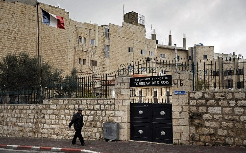 A man walks past the main gate of the Tomb of the Kings. (Thomas Coex/AFP)