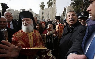 Jerusalem's Greek Orthodox Patriarch Theophilos III, center, arrives at the Church of the Nativity in the West Bank town of Bethlehem, to celebrate the Christmas mass with his community, on January 6, 2019. (Musa Al SHAER/AFP)