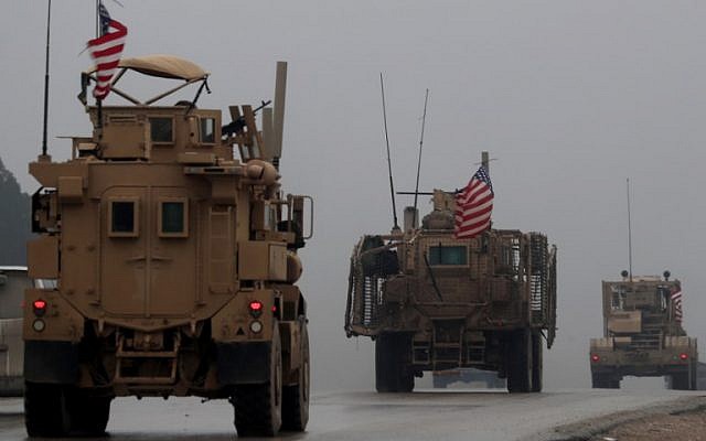 In this photo from December 30, 2018, shows a line of US military vehicles in Syria's northern city of Manbij. (Delil Souleiman/AFP) In this photo from December 30, 2018, shows a line of US military vehicles in Syria's northern city of Manbij. (Delil Souleiman/AFP)