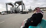 Palestinians sit waiting at the Rafah border crossing with Egypt, in the southern Gaza Strip, on January 8, 2019. (Said Khatib/AFP)