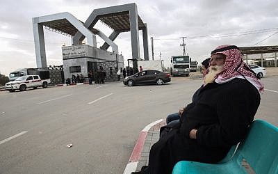 Palestinians sit waiting at the Rafah border crossing with Egypt, in the southern Gaza Strip, on January 8, 2019. (Said Khatib/AFP)