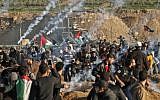 This picture taken on January 11, 2019 shows a view of clashes between Palestinians and Israeli forces across the Gaza-Israel border fence. (Mahmud Hams/AFP)