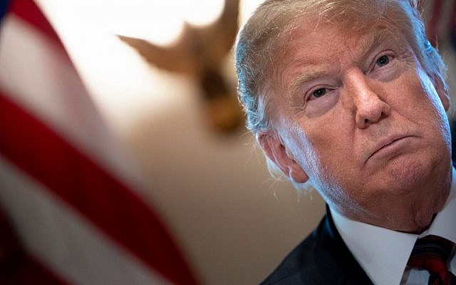US President Donald Trump listens during a meeting on border security in the Cabinet Room of the White House January 11, 2019 in Washington, DC. (Brendan Smialowski/AFP) US President Donald Trump listens during a meeting on border security in the Cabinet Room of the White House January 11, 2019 in Washington, DC. (Brendan Smialowski/AFP)