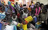 Children open presents during the 2019 Refugee Birthday Party at the Della Lamb Community Center,  n Kansas City, Missouri, January 20, 2019. (DAVE KAUP/AFP)