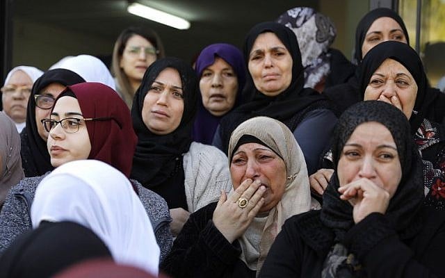 Mourners cry during the funeral of Israeli student Aya Maasarwe in the town of Baqa al-Gharbiya on January 23, 2019 (Ahmad GHARABLI / AFP) Mourners cry during the funeral of Israeli student Aya Maasarwe in the town of Baqa al-Gharbiya on January 23, 2019 (Ahmad GHARABLI / AFP)
