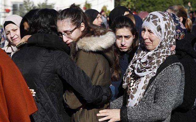 Mourners cry during the funeral of Israeli student Aya Maasarwe in the town of Baqa al-Gharbiya on January 23, 2019 (Ahmad GHARABLI / AFP) Mourners cry during the funeral of Israeli student Aya Maasarwe in the town of Baqa al-Gharbiya on January 23, 2019 (Ahmad GHARABLI / AFP)