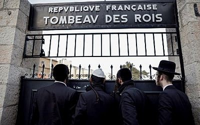 Ultra-Orthodox men at the closed gate of the Tomb of the Kings, owned and administered by the French Consulate of Jerusalem, in East Jerusalem on January 24, 2019.  (THOMAS COEX / AFP)