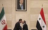 Syrian Prime Minister Imad Khamis, right, and Iranian Vice President Eshaq Jahangiri shake hands after the signing of an agreement in the capital Damascus on January 28, 2019. (LOUAI BESHARA / AFP)