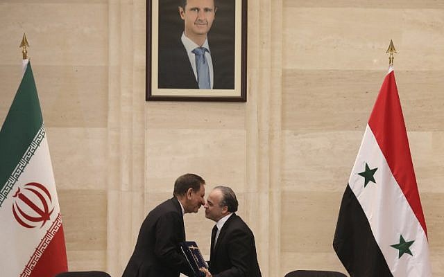 Syrian Prime Minister Imad Khamis, right, and Iranian Vice President Eshaq Jahangiri shake hands after the signing of an agreement in the capital Damascus on January 28, 2019. (LOUAI BESHARA / AFP) Syrian Prime Minister Imad Khamis, right, and Iranian Vice President Eshaq Jahangiri shake hands after the signing of an agreement in the capital Damascus on January 28, 2019. (LOUAI BESHARA / AFP)
