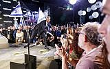 Former IDF chief of staff Benny Gantz (C) is greeted by supporters as he arrives to give his first electoral speech in the coastal city of Tel Aviv on January 29, 2019. (Jack Guez/AFP)