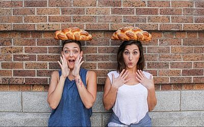 Elina Tilipman, left, and Sarah Klegman founded Challah Hub. (Sally Claire Photography/via JTA)