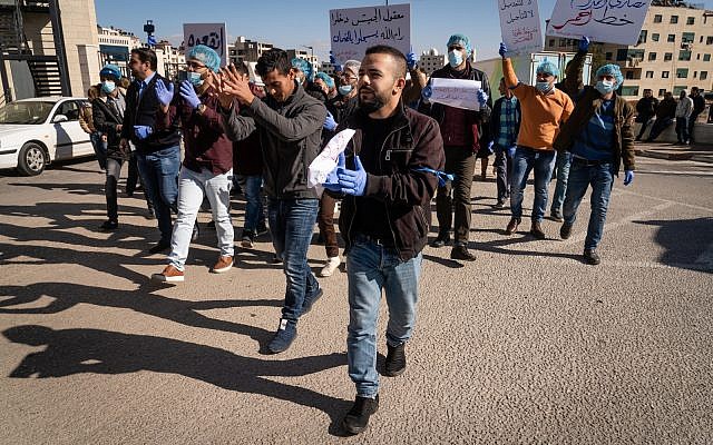 Palestinians protest against a government tax hike in Ramallah, West Bank, December 12, 2018. (Luke Tress/Times of Israel)