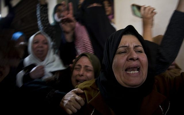 Relatives of Amal al-Taramsi mourn during her funeral in Gaza City, January 12, 2019. (AP Photo/Khalil Hamra) Relatives of Amal al-Taramsi mourn during her funeral in Gaza City, January 12, 2019. (AP Photo/Khalil Hamra)