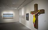 An artwork called "McJesus," which was sculpted by Finnish artist Jani Leinonen and depicts a crucified Ronald McDonald, is seen on display as part of the Haifa museum's "Sacred Goods" exhibit, in Haifa, Israel, Monday, Jan. 14, 2019. Hundreds of Christians calling for the sculpture's removal protested at the museum last week. (AP Photo/Oded Balilty)