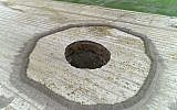 This frame grab from an August 8, 2018, video provided by Iranian Students' News Agency, ISNA, shows an aerial view of a massive hole caused by drought and excessive water pumping in Kabudarahang, in Hamadan province, in western Iran. (ISNA via AP)