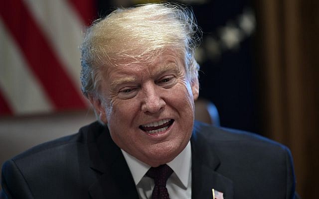 US President Donald Trump speaks in the Cabinet Room of the White House in Washington, January 23, 2019, as he hosts a roundtable with conservative leaders to discuss the security and humanitarian crisis at the southern border. (AP Photo/Susan Walsh) US President Donald Trump speaks in the Cabinet Room of the White House in Washington, January 23, 2019, as he hosts a roundtable with conservative leaders to discuss the security and humanitarian crisis at the southern border. (AP Photo/Susan Walsh)