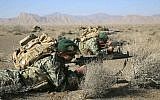 In this photo provided Friday, January 25, 2019, by the Iranian Army, soldiers take position in an infantry drill in the central Isfahan province, Iran. (Iranian Army via AP)