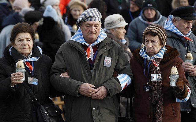 Survivors of Auschwitz, at the International Monument to the Victims of Fascism at Auschwitz II-Birkenau, walk to place candles on International Holocaust Remembrance Day in Poland, January 27, 2019. (Czarek Sokolowski/AP) Survivors of Auschwitz, at the International Monument to the Victims of Fascism at Auschwitz II-Birkenau, walk to place candles on International Holocaust Remembrance Day in Poland, January 27, 2019. (Czarek Sokolowski/AP)