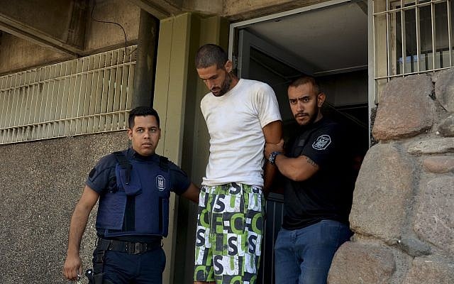 Gil Pereg is arrested as a suspect of his mother's and aunt's murders in Mendoza, Argentina, January 26, 2019. (Patricio Caneo/Los Andes via AP) Gil Pereg is arrested as a suspect of his mother's and aunt's murders in Mendoza, Argentina, January 26, 2019. (Patricio Caneo/Los Andes via AP)