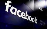 In this March 29, 2018, file photo, Facebook's logo appears on screens at the Nasdaq MarketSite in New York's Times Square. (AP Photo/Richard Drew, File)
