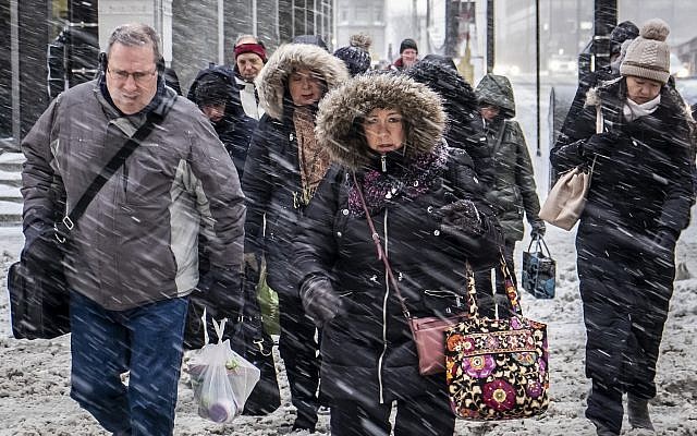 Morning commuters face a tough slog on Wacker Drive in Chicago, Monday, January 28, 2019, amid an unusual cold spell. (Rich Hein/Chicago Sun-Times via AP) Morning commuters face a tough slog on Wacker Drive in Chicago, Monday, January 28, 2019, amid an unusual cold spell. (Rich Hein/Chicago Sun-Times via AP)