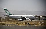 A plane from the Iranian private airline Mahan Air lands at the international airport in Sanaa, Yemen, March 1, 2015. (Hani Mohammed/AP)