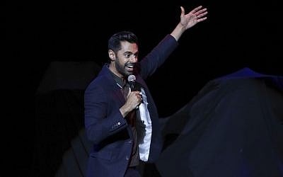 Comedian Hasan Minhaj performs on stage during the 11th Annual Stand Up for Heroes benefit on Tuesday, Nov. 7, 2017, in New York. ( Brent N. Clarke/Invision/AP)