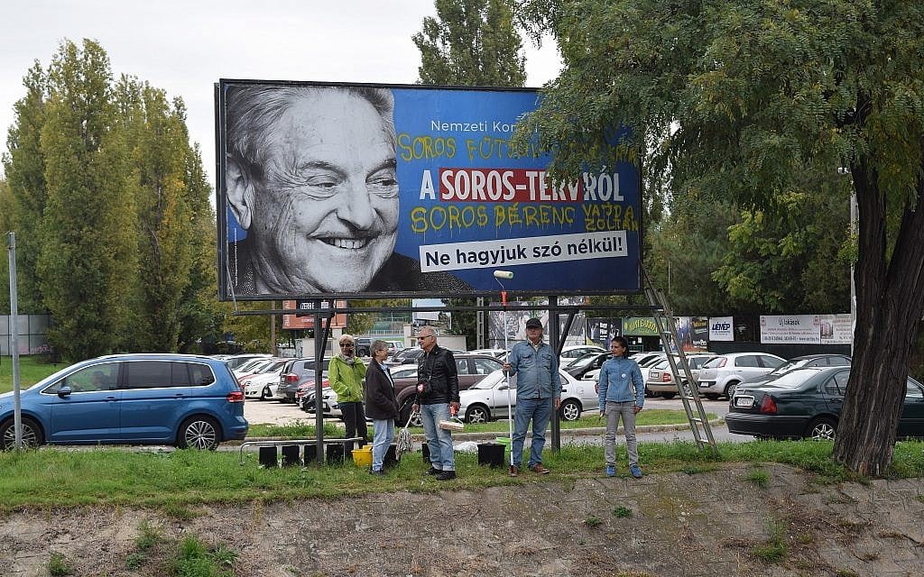 In this Oct. 5, 2017 file photo, activists from the Egyutt (Together) opposition party in Hungary stand in front of billboards of the government's campaign against George Soros and his support for migration in Budapest. (AP/Pablo Gorondi) In this Oct. 5, 2017 file photo, activists from the Egyutt (Together) opposition party in Hungary stand in front of billboards of the government's campaign against George Soros and his support for migration in Budapest. (AP/Pablo Gorondi)