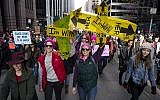 People take part in a march highlighting equal rights and equality for women walk along Sixth Avenue, Saturday, January 20, 2018, in New York. (AP Photo/Craig Ruttle)