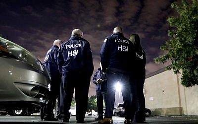 Illustrative photo of US Immigration and Customs Enforcement agents in Los Angeles,  January 10, 2018. (Chris Carlson/AP)