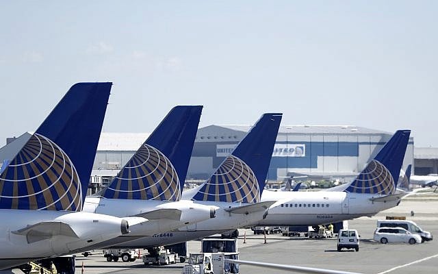 United Airlines commercial jets sit at a gate at Terminal C of Newark Liberty International Airport, July 18, 2018, in Newark, New Jersey. (AP /Julio Cortez) United Airlines commercial jets sit at a gate at Terminal C of Newark Liberty International Airport, July 18, 2018, in Newark, New Jersey. (AP /Julio Cortez)