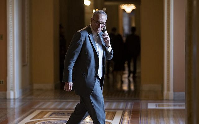 Senate Minority Leader Chuck Schumer, D-N.Y., makes a phone call just off the Senate floor on Capitol Hill in Washington, Wednesday, Aug. 1, 2018. (AP Photo/J. Scott Applewhite) Senate Minority Leader Chuck Schumer, D-N.Y., makes a phone call just off the Senate floor on Capitol Hill in Washington, Wednesday, Aug. 1, 2018. (AP Photo/J. Scott Applewhite)