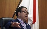 Japan’s Trade Minister Hiroshige Seko speaks during an exclusive interview with The Associated Press at his office in Tokyo Thursday, Aug. 23, 2018; (AP Photo/Eugene Hoshiko)