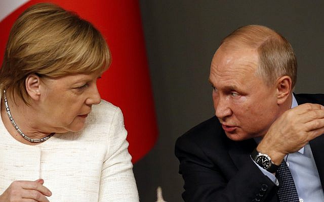 German Chancellor Angela Merkel, left, listens to Russian President Vladimir Putin as they attend a news conference following a summit on Syria, in Istanbul, October 27, 2018. (AP Photo/Lefteris Pitarakis) German Chancellor Angela Merkel, left, listens to Russian President Vladimir Putin as they attend a news conference following a summit on Syria, in Istanbul, October 27, 2018. (AP Photo/Lefteris Pitarakis)