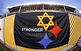 A 'Stronger Than Hate' banner is displayed on the sidelines before an NFL Football game between the Pittsburgh Steelers and the Carolina Panthers, Thursday, November 8, 2018, at Heinz Field in Pittsburgh. (AP/Gene J. Puskar)
