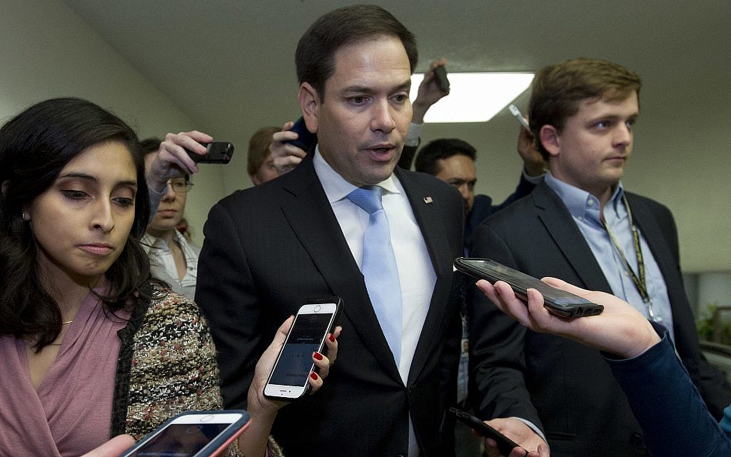 Sen. Marco Rubio, R-Fla., speaks with reporters on his way to the senate chamber, as the Senate takes up a House-passed bill that would pay for President Donald Trump's border wall and avert a partial government shutdown, at the Capitol in Washington, Friday, Dec. 21, 2018. (AP Photo/Jose Luis Magana) Sen. Marco Rubio, R-Fla., speaks with reporters on his way to the senate chamber, as the Senate takes up a House-passed bill that would pay for President Donald Trump's border wall and avert a partial government shutdown, at the Capitol in Washington, Friday, Dec. 21, 2018. (AP Photo/Jose Luis Magana)
